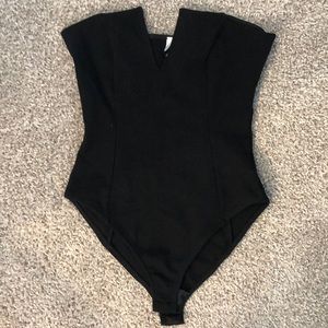 Out from under black bodysuit